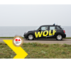 WOLF Rijbewijsshop auto op dijk en Dutch Interactive Awards winnaarslogo